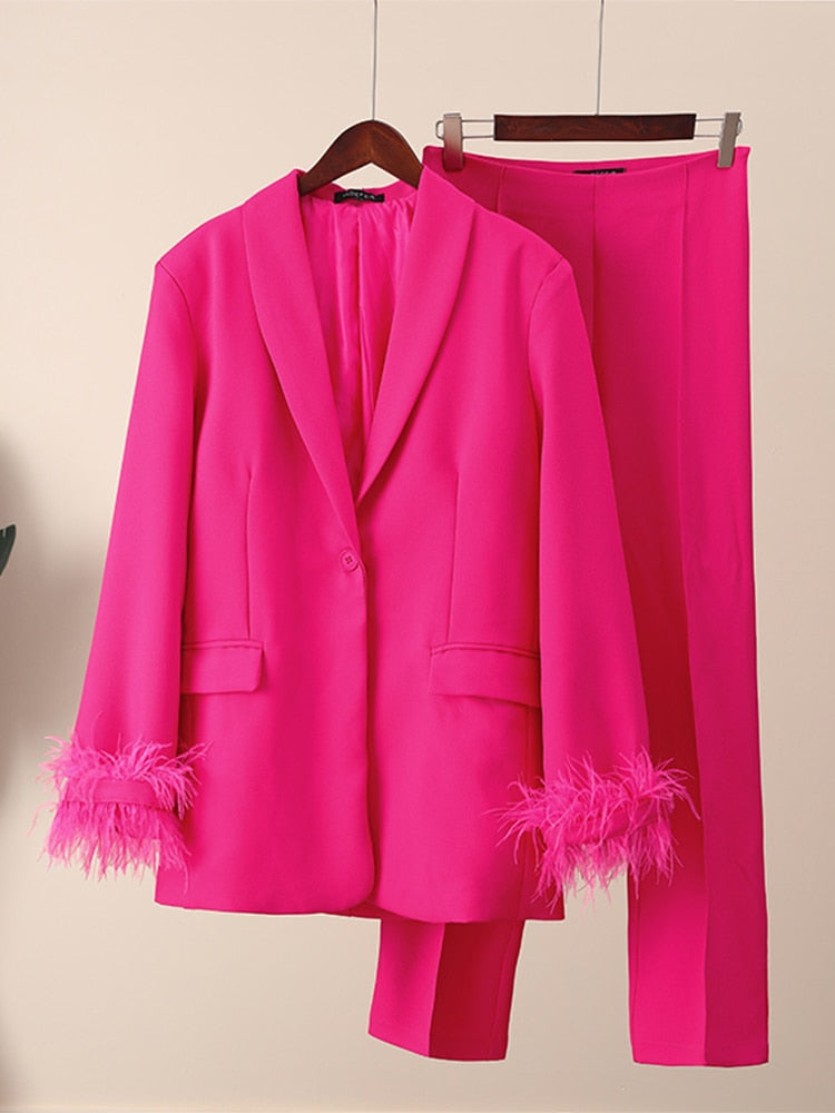 Pink suit with feathers
