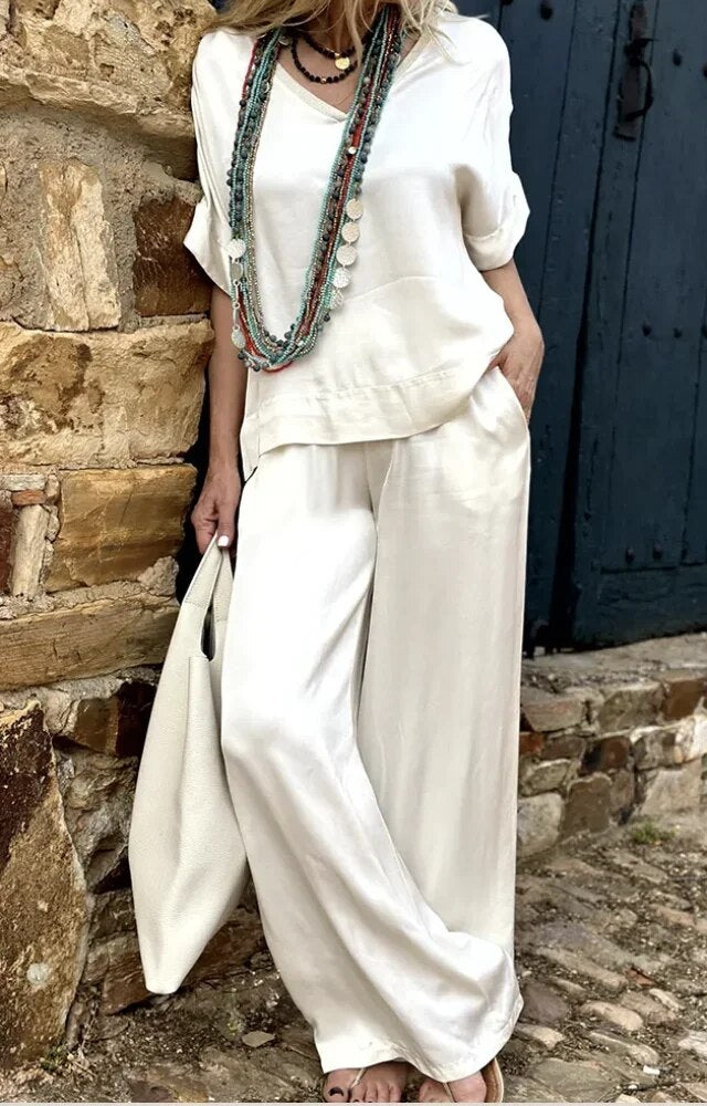 Airelyn - Elegant white top with V-neck and wide legs