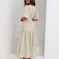 Emilia - dress with V-neck and puff sleeves