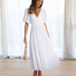 Emilia - dress with V-neck and puff sleeves
