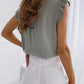 Sleeveless Blouse with Ruffles and Bow Detail
