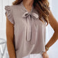 Sleeveless Blouse with Ruffles and Bow Detail