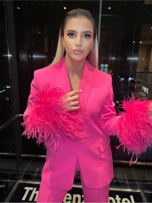 Pink suit with feathers