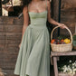 Dahlia - Elegant pleated strapless dress