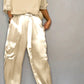 Kleya - Two-piece suit in smooth satin with mid-length top and trousers for women